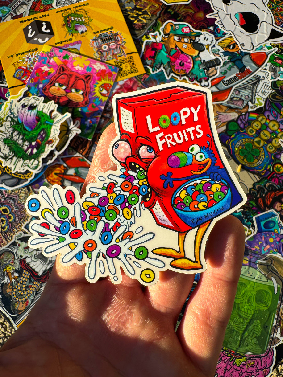 a fun, vibrant sticker in hand