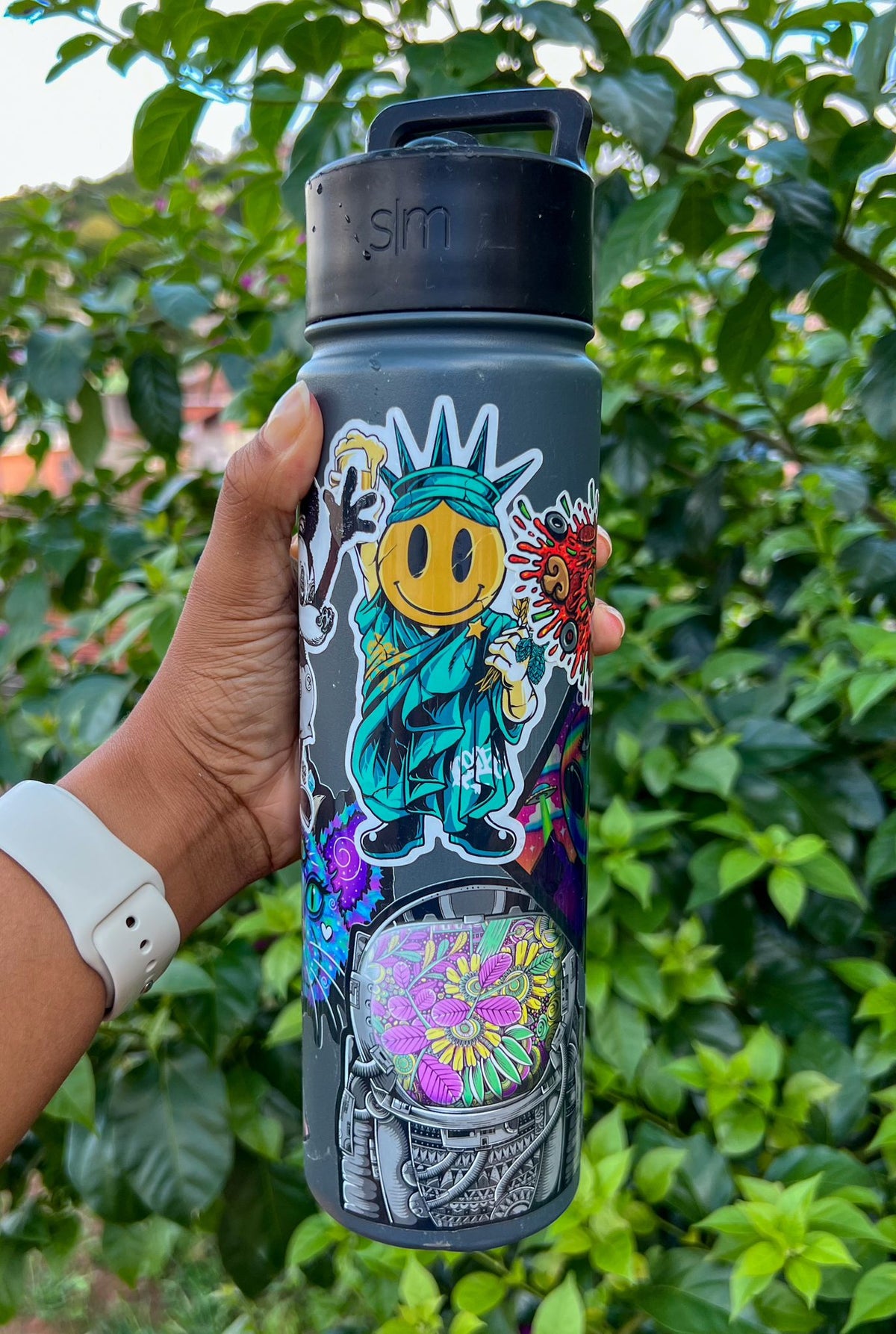 a stickerbombed water bottle featuring sticker savage stickers.