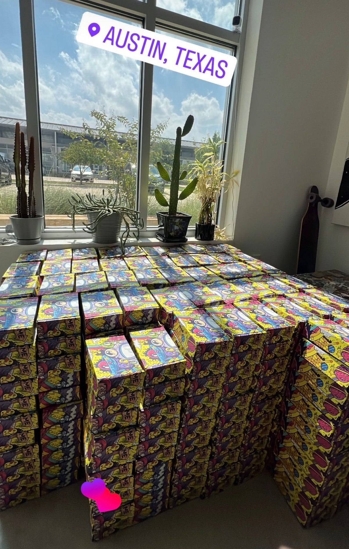 a bunch of sticker filled boxes by the window in our warehouse in Austin, Texas.